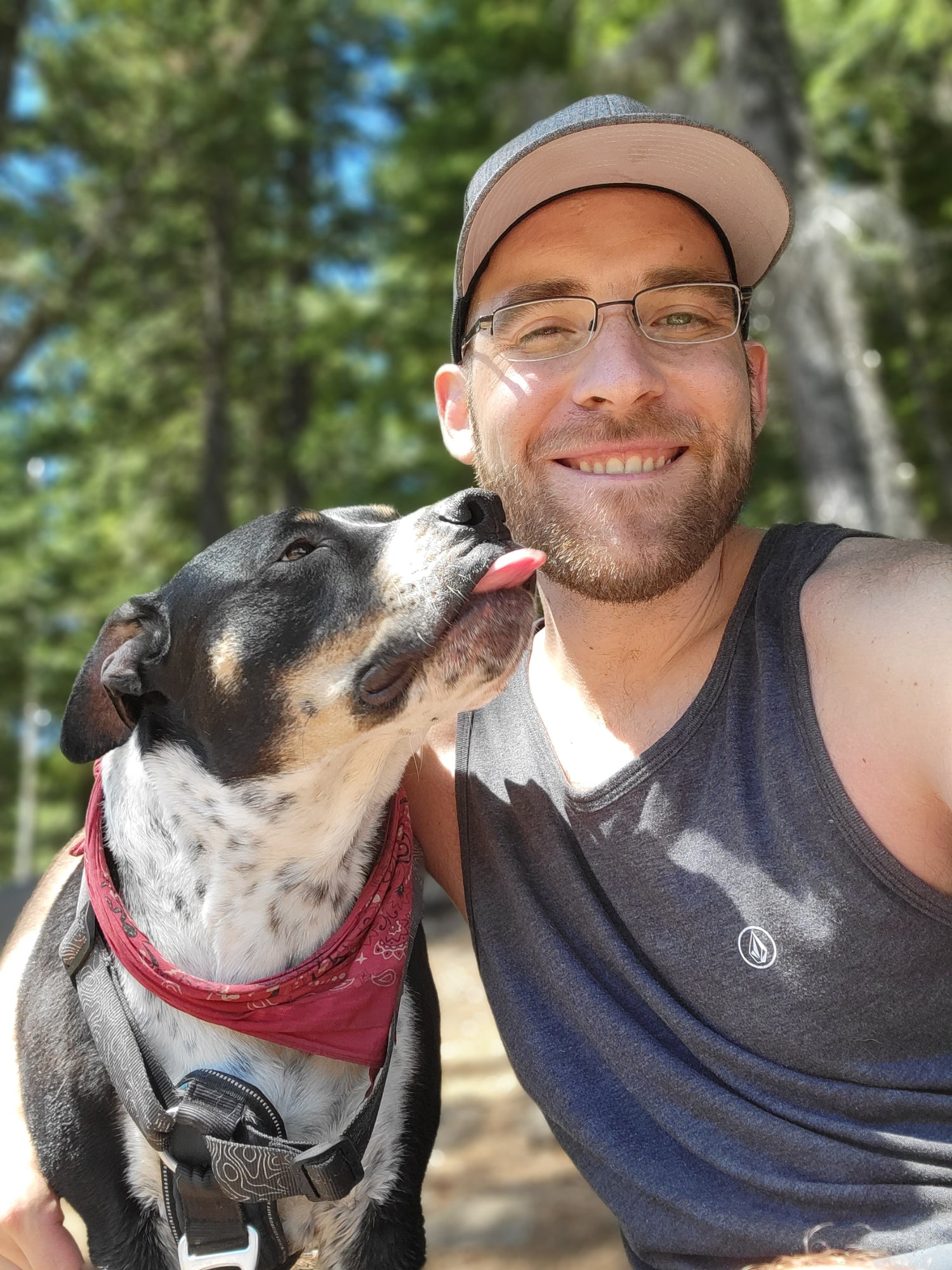 Brandon, founder of SIBIN, sitting outdoors with his dog, reflecting the personal and grounded roots of the brand.